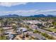 Scenic aerial view of the neighborhood showcasing beautiful mountain views in the distance at 6418 E Sunnyside Dr, Scottsdale, AZ 85254
