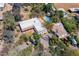 Aerial view of the home featuring a detached guest house, swimming pool and lush, mature landscaping at 6418 E Sunnyside Dr, Scottsdale, AZ 85254