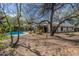 Private backyard oasis with a sparkling pool, mature landscaping and shade trees at 6418 E Sunnyside Dr, Scottsdale, AZ 85254