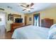 Large bedroom featuring hardwood floors, a ceiling fan, and direct access to the outside at 6418 E Sunnyside Dr, Scottsdale, AZ 85254