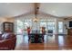 Well-lit dining area showcases a stylish table and chairs with views of the outdoor patio at 6418 E Sunnyside Dr, Scottsdale, AZ 85254