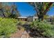 Charming single-story home with a stone pathway leading to the front entrance at 6418 E Sunnyside Dr, Scottsdale, AZ 85254