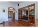 Beautiful entryway leading to a cozy study through rustic glass-paned sliding doors at 6418 E Sunnyside Dr, Scottsdale, AZ 85254