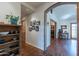 Charming hallway showcasing tile floors, decorative archways, and a glimpse of the living space at 6418 E Sunnyside Dr, Scottsdale, AZ 85254