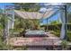 Secluded hot tub area featuring a stylish shade structure and serene, landscaped surroundings for ultimate relaxation at 6418 E Sunnyside Dr, Scottsdale, AZ 85254