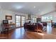 Spacious living room with hardwood floors, French doors, and a cozy seating area at 6418 E Sunnyside Dr, Scottsdale, AZ 85254