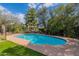 Refreshing pool with a classic design, surrounded by an ample concrete patio and easy-care artificial turf at 6418 E Sunnyside Dr, Scottsdale, AZ 85254