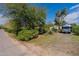 View of the home from the street, showing the landscaping and a vintage Airstream trailer at 6418 E Sunnyside Dr, Scottsdale, AZ 85254