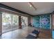 Bright studio with a large mural and oversized windows overlooking the pool area at 6418 E Sunnyside Dr, Scottsdale, AZ 85254