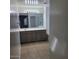 Bathroom features a large mirror, gray vanity, and tiled flooring at 6908 S 8Th Dr, Phoenix, AZ 85041