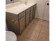 Bathroom with modern vanity, gray cabinets and square tiled floors at 6908 S 8Th Dr, Phoenix, AZ 85041