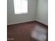 Comfortable bedroom with carpet and natural light from the window at 6908 S 8Th Dr, Phoenix, AZ 85041