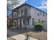 Attractive two-story home showcasing a balcony, desert landscaping, and charming architectural details at 6908 S 8Th Dr, Phoenix, AZ 85041