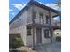 Inviting two-story residence featuring a charming balcony, well-kept grounds, and stylish design elements at 6908 S 8Th Dr, Phoenix, AZ 85041