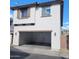 Spacious two-car garage featuring an automatic door and ample room for vehicles and storage at 6908 S 8Th Dr, Phoenix, AZ 85041
