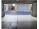 Clean and spacious garage featuring a concrete floor, offering ample room for vehicle parking and storage at 6908 S 8Th Dr, Phoenix, AZ 85041