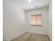 Bedroom with neutral carpet, white walls, and a window with blinds, providing a blank canvas for personalization at 6941 E Snowdon St, Mesa, AZ 85207