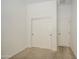 Bedroom featuring neutral carpet, white walls, and a closet with sliding doors, offering a clean and versatile space at 6941 E Snowdon St, Mesa, AZ 85207