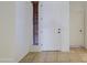 Bright entryway with tiled floor, white paneled door, and view to another room at 6941 E Snowdon St, Mesa, AZ 85207