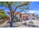 Charming home with mature tree, tile roof, and low-maintenance landscaping at 6941 E Snowdon St, Mesa, AZ 85207