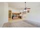 Open-concept kitchen features an island, stainless steel appliances, and ample counter space at 6941 E Snowdon St, Mesa, AZ 85207