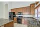 Cozy kitchen featuring granite counters and stainless steel appliances at 6941 E Snowdon St, Mesa, AZ 85207