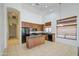 Bright kitchen with an island, granite counters, and ample counter space at 6941 E Snowdon St, Mesa, AZ 85207