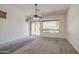 Cozy living room with sliding glass door and lots of natural light at 6941 E Snowdon St, Mesa, AZ 85207