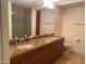 Bathroom featuring double sinks with granite countertops and spacious cabinetry at 7157 E Rancho Vista Dr # 1004, Scottsdale, AZ 85251