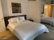 Bedroom with a large bed, nightstand, decorative art and mirrored closet doors at 7157 E Rancho Vista Dr # 1004, Scottsdale, AZ 85251
