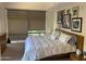 Bright bedroom with large window, decorative art and a king size bed at 7157 E Rancho Vista Dr # 1004, Scottsdale, AZ 85251