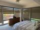 Bedroom with large windows, blinds and a comfortable bed at 7157 E Rancho Vista Dr # 1004, Scottsdale, AZ 85251