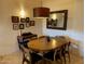 Cozy dining room features a wooden table with seating for six and a decorative lighting fixture at 7157 E Rancho Vista Dr # 1004, Scottsdale, AZ 85251