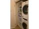 Laundry room with stacked washer and dryer, storage and shelving space at 7157 E Rancho Vista Dr # 1004, Scottsdale, AZ 85251