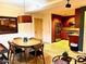 Open-concept living space with wood accents and a modern kitchen that features stainless steel appliances and tiled flooring at 7157 E Rancho Vista Dr # 1004, Scottsdale, AZ 85251