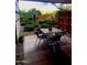 Private outdoor patio with dining set and landscaped garden, offering a tranquil setting for relaxation and enjoyment at 7157 E Rancho Vista Dr # 1004, Scottsdale, AZ 85251