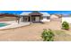 White home showcasing a large backyard with a refreshing pool and a covered patio area, perfect for entertaining at 7231 W Sierra Vista Dr, Glendale, AZ 85303