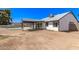 Backyard area featuring a covered patio, a crisp white home exterior, and an in-ground pool for outdoor enjoyment at 7231 W Sierra Vista Dr, Glendale, AZ 85303
