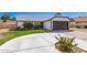 Charming single-story home with a well-manicured lawn and attached two-car garage on a sunny day at 7231 W Sierra Vista Dr, Glendale, AZ 85303