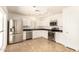 Bright kitchen featuring stainless steel appliances and modern lighting at 7231 W Sierra Vista Dr, Glendale, AZ 85303