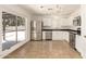 Bright kitchen featuring stainless steel appliances and a window overlooking the patio at 7231 W Sierra Vista Dr, Glendale, AZ 85303