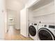 This laundry room offers a modern washer and dryer at 7231 W Sierra Vista Dr, Glendale, AZ 85303