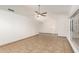 Bright living room featuring tiled floors, neutral walls, large windows, and a ceiling fan at 7231 W Sierra Vista Dr, Glendale, AZ 85303