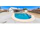 Backyard featuring a sparkling pool, a covered patio, and a home exterior, creating a relaxing outdoor oasis at 7231 W Sierra Vista Dr, Glendale, AZ 85303