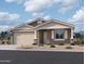 Charming single-story home with a two-car garage and inviting desert landscaping at 7703 W Saddlehorn Rd, Peoria, AZ 85383