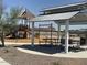 Community playground with a covered picnic area and play structure at 7703 W Saddlehorn Rd, Peoria, AZ 85383