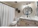 Well-lit bathroom with a marble-style sink and a shower featuring a stylishly patterned curtain at 782 W Gail Dr, Chandler, AZ 85225