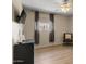 Bedroom with a large window, hardwood floors, and a modern chair with decorative pillows at 782 W Gail Dr, Chandler, AZ 85225