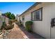Side exterior view with desert landscape and a brick pathway at 782 W Gail Dr, Chandler, AZ 85225