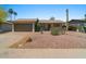 Well-maintained single-story home with a two-car garage, desert landscaping and palm trees at 782 W Gail Dr, Chandler, AZ 85225